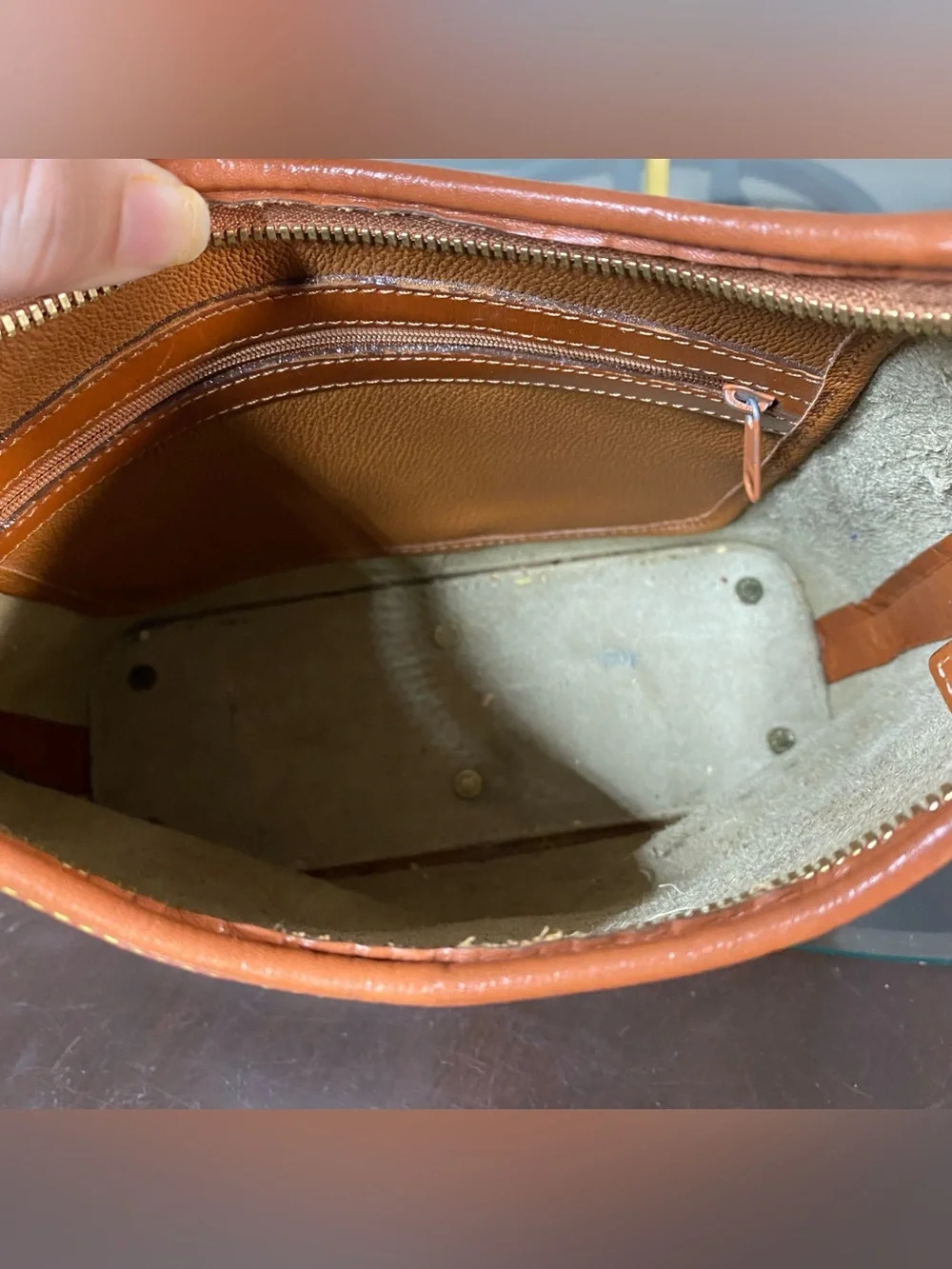Dooney & Bourke adjustable zipper completely